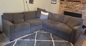 lot 116 image: Gray U-Shaped Sectional Sofa with Cushions - Rug NOT Inc