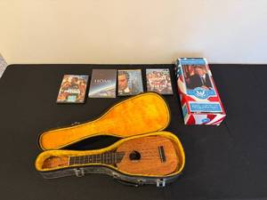 lot 168 image: Ukulele with Vintage Case, President William J. Clinton Talking Figure, and 4 DVDs