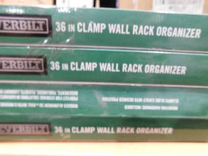 lot 65 image: (4) Everbilt 36 in Adjustable Aluminum X-Clamp Wall Mount Storage Tool Organizer