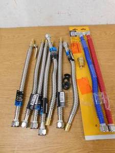 lot 34 image: (9) 34 PEX WATER HEATER CONNECTORS W ADDITONAL KIT