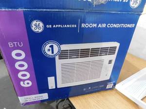 lot 7 image: GE 6,000 BTU 115V Window Air Conditioner Cools 250 Sq. Ft. in White