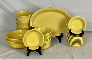 lot 20 image: Vintage Fiesta in Yellow - Homer Laughlin China Company -  Includes 4- 6 Bowls , 2-8 Serving Bowls, 13 Tray, 6 - 5.5 Bowls, 9 - Dessert Bowls