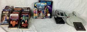 lot 41 image: Star Trek Bundle- Includes USS Enterprise Model, Magellan Radio Alarm Clock, and Collection of Books