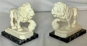 lot 14 image: Sculptor A. Santini - Pair of Lion Sculptures Constructed of Marble Composite on Dark Marble Base - 5.5D x 6H x 3.5 W