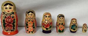 lot 83 image: Two Sets of Hand Painted Russian Nesting Dolls
