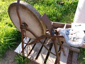 lot 94 image: Antique Sit Down Round Stone Pedal Grinder (Yard Art)