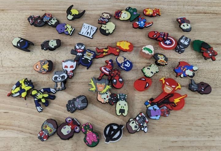 lot 43 image: 50 Brand New Croc Charms of Comic Book Characters