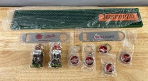 lot 85K image: Brand New Bar Promotional Items - Jagermeister Bar Mat, Coors & Grain Belt Openers, Angry Orchard & Redds Apple Keychains