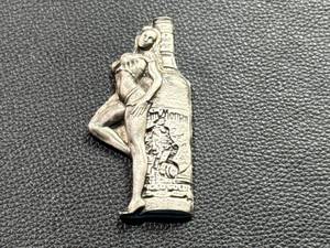 lot 20 image: 3.3oz .999 Silver Woman & Captain Morgan Bottle