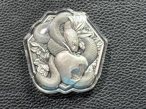 lot 22 image: Silver Piece with Snake and Apple Design - .999, 2oz