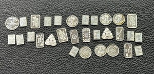 lot 33 image: 1 oz Assorted Silver Pieces Featuring Various Designs