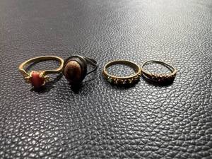 lot 81 image: Four Assorted Rings Featuring Gemstones