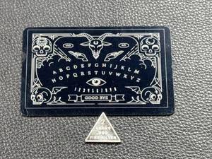 lot 89 image: Navarro Rings Ouija-Inspired Metal Card With 2 Gram Silver Triangle Token