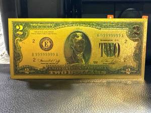 lot 95 image: Gold-Toned Novelty $2 Bill Featuring 1976 Design with Serial Number B99999999A