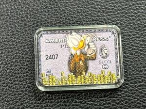 lot 99 image: 1 Troy Ounce .999 Silver Bar Featuring Duck and Dollar Bag Design