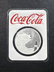 lot 123 image: Coca-Cola Polar Bear 1oz .999 Fine Silver Round in Original Packaging