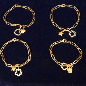 lot 43 image: Set of 4 Golden Odyssey 14K Plated 8 Paperclip Lariat Bracelets