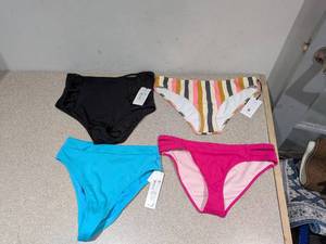 lot 54 image: (4) NEW ASSORTED WOMENS SWIMWEAR BOTTOMS (SMALL)