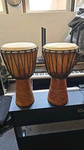 lot 18 image: Pair of 24 Wooden Djembe Drums with Carved Patterns, Rope Tuning
