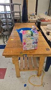lot 68 image: Wooden Workbench with Lower Shelf, Approx. 72x30x34, Sturdy Construction. 30 bottles of dye included.