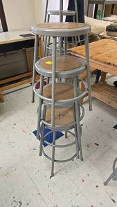lot 70 image: (4) Stackable Gray Metal Stools with Wooden Seats