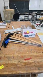 lot 76 image: Staedtler Mars 970 20 Drafting T-Square, 24-inch, Wood and Plastic, all contents on top of table.