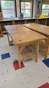 lot 79 image: Large wooden workbench with storage shelf