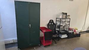 lot 109 image: Metal Storage Cabinet, Metal rolling cart, rolling gaming computer chair, metal shelf including all contents.