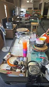 lot 136 image: Assorted Kitchenware and Small Appliances, Mixed Materials and Colors, ALL contents on top of air hockey table.