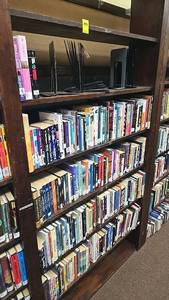 lot 202 image: Over 100 Books, 4 Shelves, Various Genres. Bookshelf NOT Included.