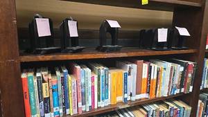lot 203 image: Bookshelf with Approximately 100 Books, Mixed Genres. Bookshelf NOT included.