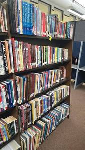 lot 223 image: Large Bookshelf with Over 100 Books, Diverse Topics