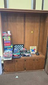 lot 242 image: Wooden Bookshelf with board games.