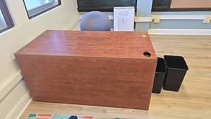 lot 268 image: Office Furniture Set with Reddish Brown Desk and Gray Office Chair, (2) black garbage bins.