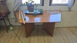 lot 286D image: Brown Wooden Desk with Flat Top and Open Leg Space, with contents of table.