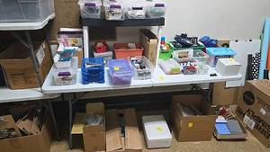 lot 323 image: Assorted Office Supplies and Storage Containers, Mixed Materials, Various Sizes, Folding Table