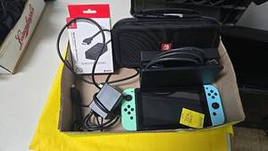 lot 352 image: Nintendo Switch Console, BlueGreen Joy-Con, LAN Adapter, Carrying Case