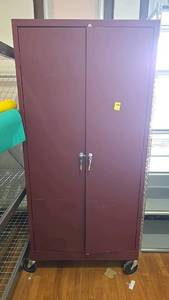 lot 566 image: Burgundy Metal Storage Cabinet with Wheels and Key Lock