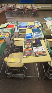 lot 618 image: (4) Four, Classroom Desk with Integrated Chair, Metal Frame, Beige, featuring a wooden top, with green and yellow seats