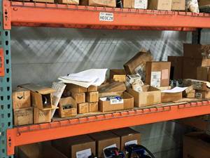 lot 408 image: Lot of (Shelf Contents) Assorted Replacement Parts, Shut-Off Valves, Mount Brackets, Hose (in original packaging)