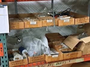 lot 412 image: Lot of (Shelf Contents) Assorted Replacement Parts, ATX Flush Canister, PSX II Switch, Fuse 15A, Clamps, Valve Forks, Seals (in original packaging)