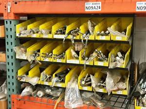 lot 421 image: Lot of (Shelf Contents) Parts Organizer 24-bin  Rack with Contents of Assorted Replacement Parts, Hose Connectors (in original packaging)