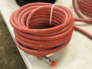 lot 209 image: 300-PSI Hose 38 x 50 (in original packaging)