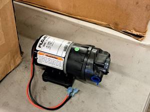 lot 281 image: Flojet Electric Pump Motor #D3121E1311 (in original packaging)