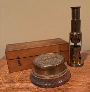 lot 414 image: Vintage Portable Brass Microscope and Trident Neptune Meter Cap