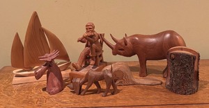 lot 595 image: Variety of Wooden Figurines including Rhinoceros, Sailboat, Dog, Moose and More