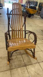 lot 3 image: Wooden Rocking Chair with Rustic Design
