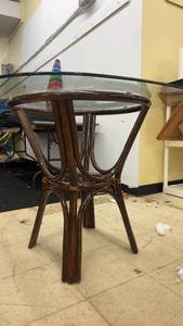 lot 9 image: Round Glass Top Rattan Dining Table