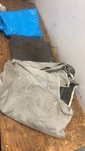 lot 69 image: Set of Three Assorted Tarps - Blue, Gray, and Black