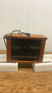 lot 77 image: Heat Surge Electric Fireplace Heater with Remote Control